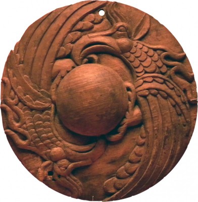 Figure 2. An Iron Age wooden roundel from Tuetka I, Altai Republic, Russian Federation (12.5cm diameter); © ECAIC Project.